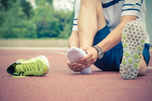 Man with foot pain during sport.